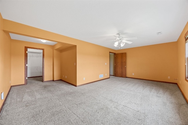 660 Garfield Rd, West Branch, IA 52358 - unfurnished room with ceiling fan and carpet floors