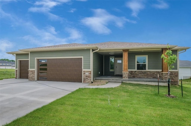 1529 3rd St SW, Mount Vernon, IA 52314 - prairie-style house with an attached garage, stone siding, a porch, and driveway