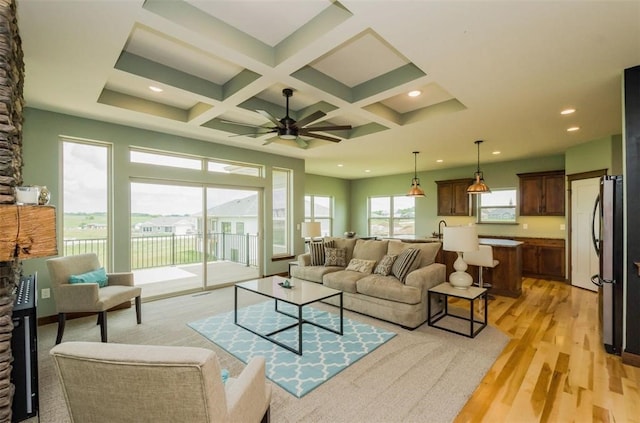 1529 3rd St SW, Mount Vernon, IA 52314 - living area featuring light wood-style flooring, beam ceiling, ceiling fan, recessed lighting, and coffered ceiling