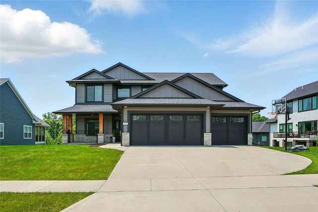 1643 Avalon Pl, Iowa City, IA 52245 - craftsman-style home featuring board and batten siding, concrete driveway, a garage, a front yard, and stone siding
