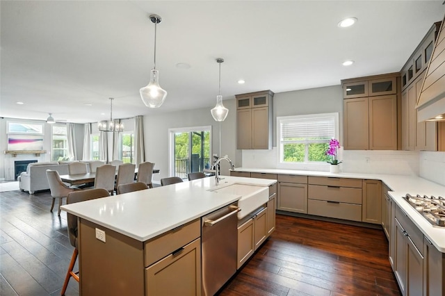 1643 Avalon Pl, Iowa City, IA 52245 - kitchen with appliances with stainless steel finishes, healthy amount of natural light, a breakfast bar, dark wood-style flooring, and recessed lighting