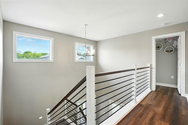 1643 Avalon Pl, Iowa City, IA 52245 - corridor with an upstairs landing, dark wood-style floors, a chandelier, and recessed lighting