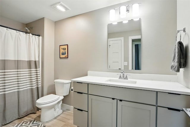 1643 Avalon Pl, Iowa City, IA 52245 - bathroom with vanity, wood finished floors, and curtained shower