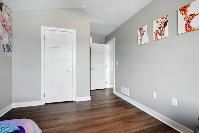 1643 Avalon Pl, Iowa City, IA 52245 - unfurnished bedroom featuring dark wood-style flooring and vaulted ceiling