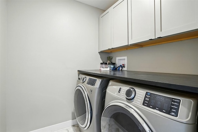 1643 Avalon Pl, Iowa City, IA 52245 - laundry room featuring cabinet space, washer and clothes dryer, and marble look tile flooring
