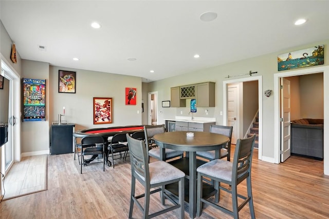 1643 Avalon Pl, Iowa City, IA 52245 - dining room featuring light wood-style flooring, recessed lighting, and stairway