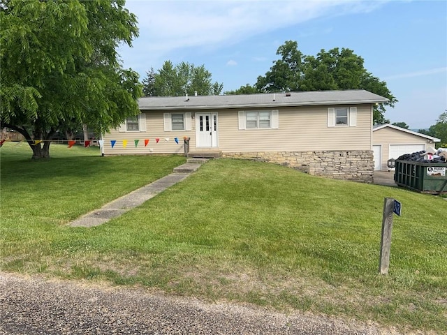 312 Lake View Dr NE, Solon, IA 52333 - ranch-style house with a front yard and a garage