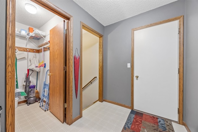 2215 Balsam Ct, Iowa City, IA 52240 - entrance foyer with a textured ceiling and baseboards