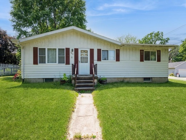304 3rd St S, Coggon, IA 52218 - view of front facade featuring board and batten siding