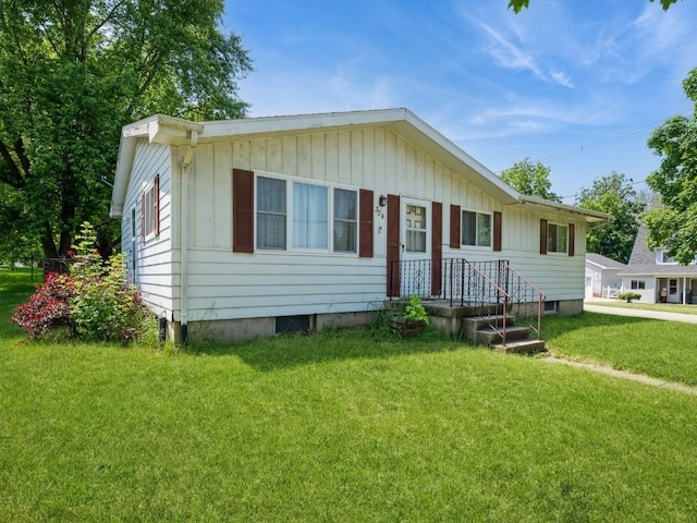 304 3rd St S, Coggon, IA 52218 - view of front of house featuring a front lawn
