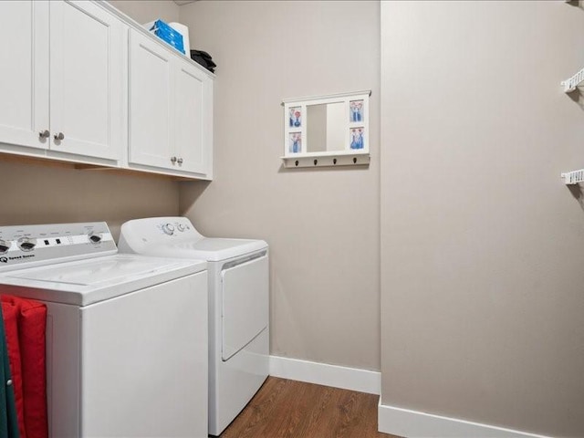100 4th Ave SW Unit 204, Cedar Rapids, IA 52404 - laundry room featuring separate washer and dryer, cabinet space, and dark wood-style floors