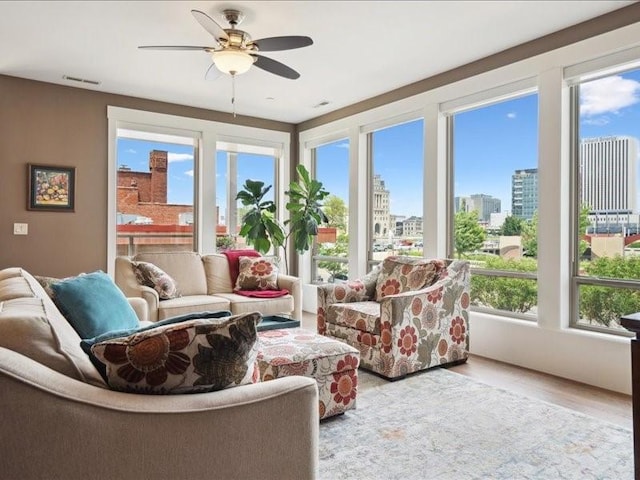 100 4th Ave SW Unit 204, Cedar Rapids, IA 52404 - sunroom / solarium with a city view and wood finished floors