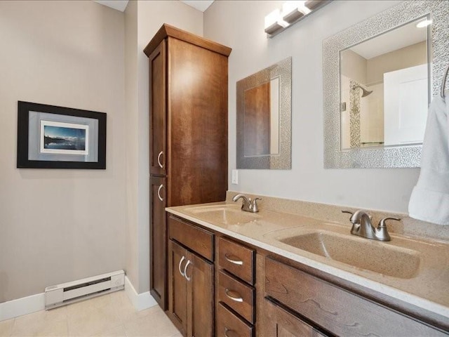 100 4th Ave SW Unit 204, Cedar Rapids, IA 52404 - full bathroom with baseboard heating, double vanity, and tile patterned flooring