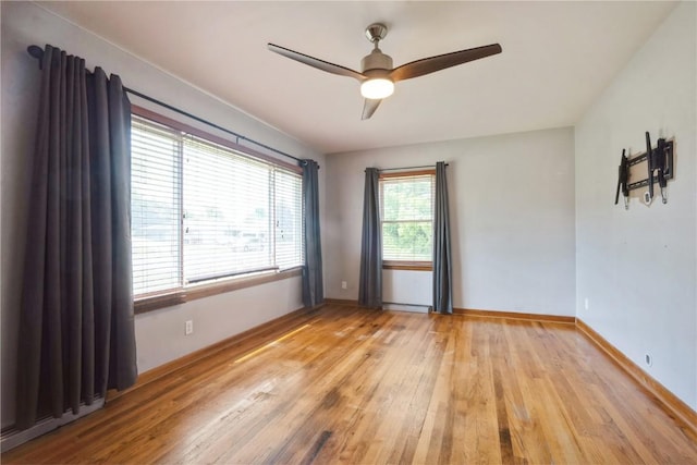 2901 J St SW, Cedar Rapids, IA 52404 - empty room with light wood-style floors and ceiling fan