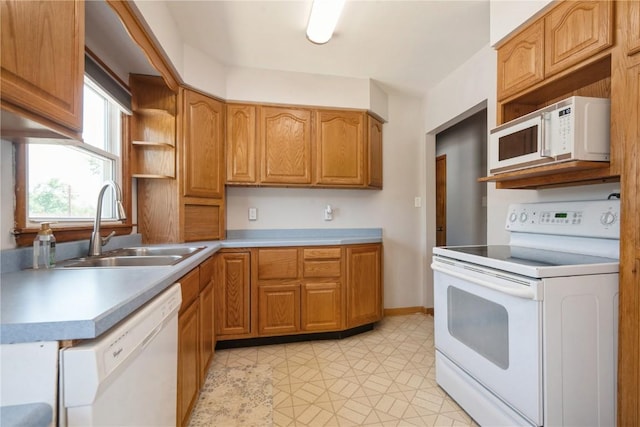 2901 J St SW, Cedar Rapids, IA 52404 - kitchen with white appliances, open shelves, light countertops, and brown cabinets