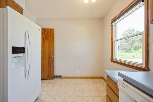 2901 J St SW, Cedar Rapids, IA 52404 - kitchen with white appliances, light countertops, and light flooring