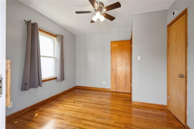 2901 J St SW, Cedar Rapids, IA 52404 - spare room featuring light wood-type flooring and a ceiling fan