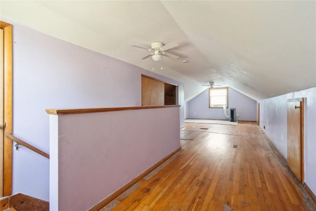 2901 J St SW, Cedar Rapids, IA 52404 - additional living space featuring light wood-type flooring, vaulted ceiling, and ceiling fan
