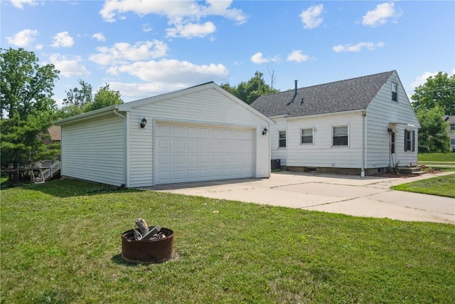 2901 J St SW, Cedar Rapids, IA 52404 - view of front of house featuring a garage, a front yard, and an outdoor structure