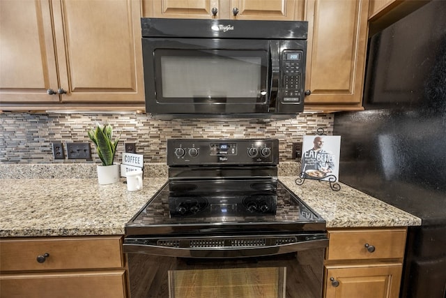 345 Shannon Dr, Robins, IA 52328 - kitchen featuring black appliances, backsplash, and light stone countertops