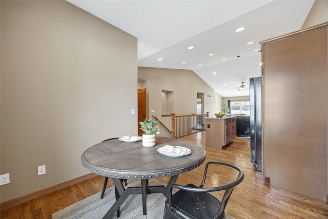 345 Shannon Dr, Robins, IA 52328 - dining area featuring light wood-style floors, vaulted ceiling, and recessed lighting