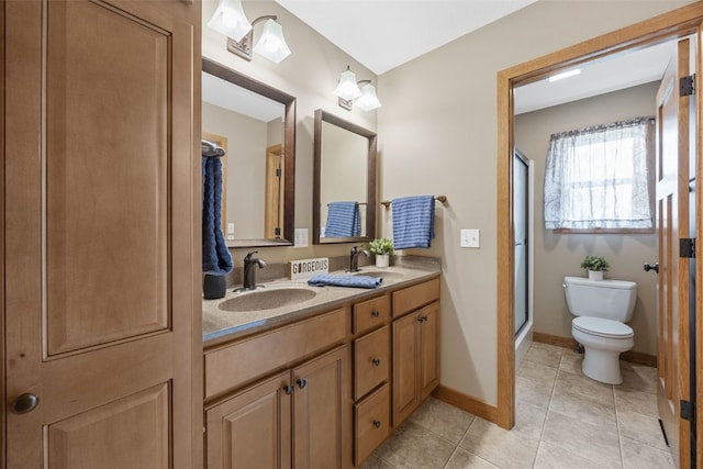 345 Shannon Dr, Robins, IA 52328 - bathroom featuring double vanity, a shower stall, and tile patterned flooring