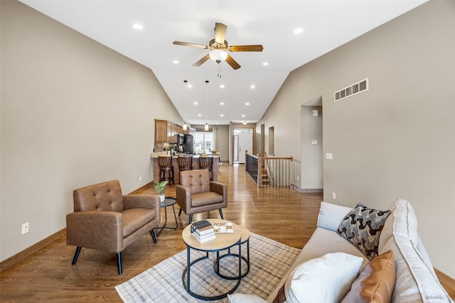 345 Shannon Dr, Robins, IA 52328 - living room with a ceiling fan, light wood-type flooring, vaulted ceiling, and recessed lighting