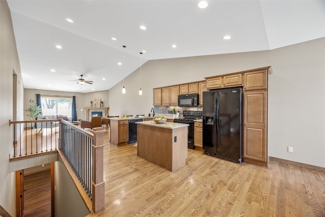 345 Shannon Dr, Robins, IA 52328 - kitchen with black appliances, lofted ceiling, a center island, open floor plan, and a ceiling fan