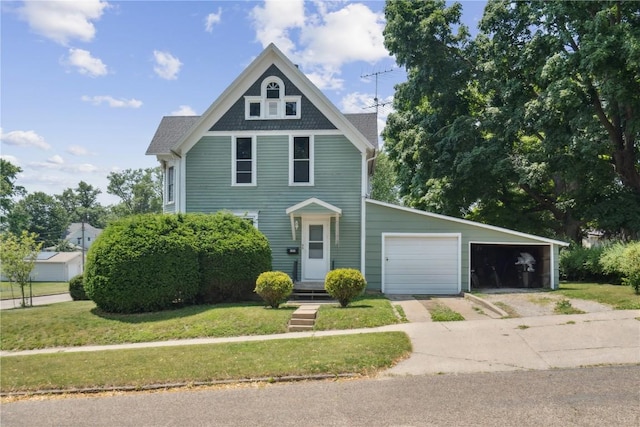 1802 9th Ave, Belle Plaine, IA 52208 - victorian house with driveway and a front lawn