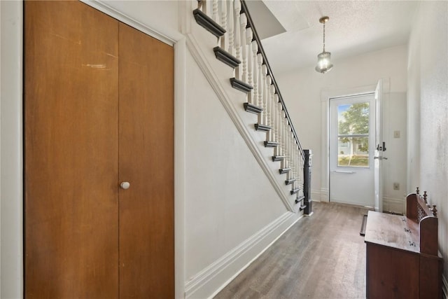 1802 9th Ave, Belle Plaine, IA 52208 - entrance foyer with wood finished floors and stairway