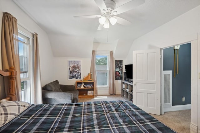1802 9th Ave, Belle Plaine, IA 52208 - bedroom with vaulted ceiling, carpet, and ceiling fan