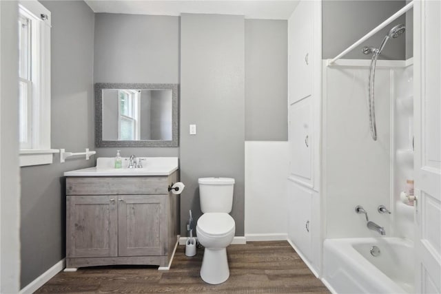 1802 9th Ave, Belle Plaine, IA 52208 - full bath with wood finished floors, vanity, and shower / bath combination