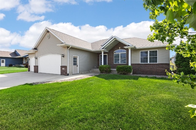 429 W Prairie Dr, Fairfax, IA 52228 - single story home with brick siding, concrete driveway, an attached garage, and a front yard