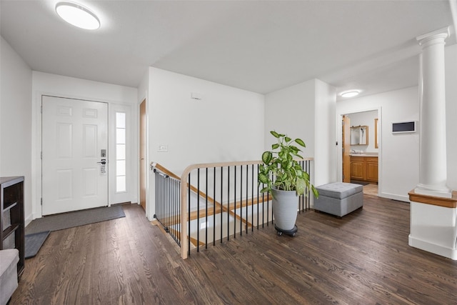 429 W Prairie Dr, Fairfax, IA 52228 - entryway featuring ornate columns and dark wood finished floors