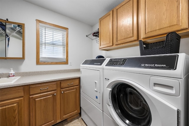 429 W Prairie Dr, Fairfax, IA 52228 - laundry area with washing machine and dryer and cabinet space