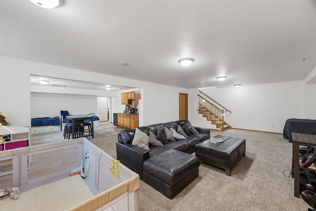 429 W Prairie Dr, Fairfax, IA 52228 - living area featuring stairs and light colored carpet