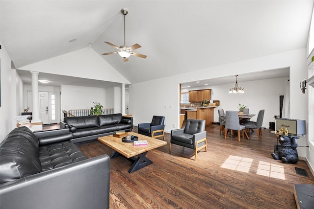 429 W Prairie Dr, Fairfax, IA 52228 - living area featuring wood finished floors, high vaulted ceiling, ceiling fan, decorative columns, and a chandelier