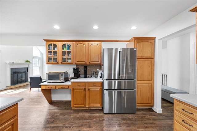 429 W Prairie Dr, Fairfax, IA 52228 - kitchen featuring freestanding refrigerator, light countertops, dark wood finished floors, glass insert cabinets, and recessed lighting