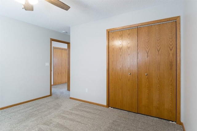 310 34th Ave, Marion, IA 52302 - unfurnished bedroom with a closet, carpet, and a ceiling fan