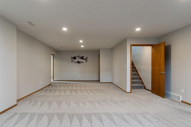 310 34th Ave, Marion, IA 52302 - empty room with carpet flooring, stairs, and recessed lighting