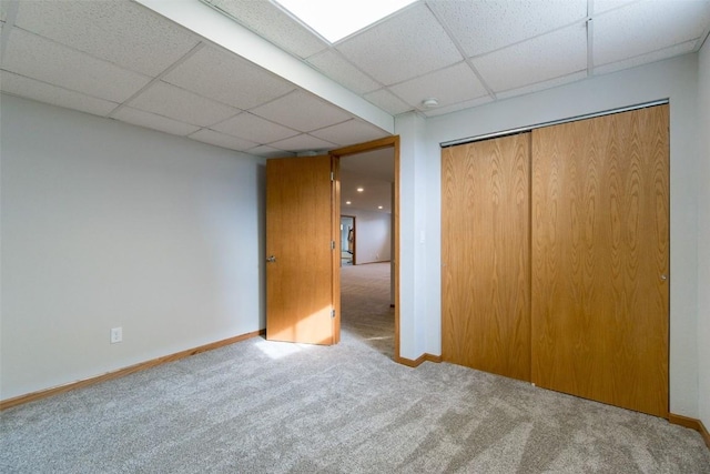 310 34th Ave, Marion, IA 52302 - unfurnished bedroom featuring carpet flooring, a drop ceiling, and a closet
