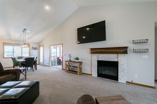 310 34th Ave, Marion, IA 52302 - living area featuring carpet floors, high vaulted ceiling, and a fireplace