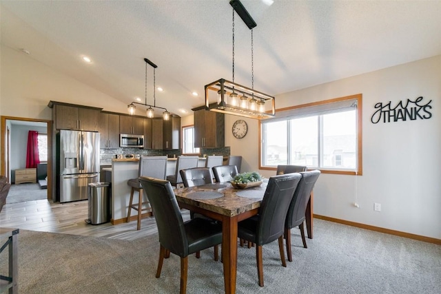 310 34th Ave, Marion, IA 52302 - dining area featuring plenty of natural light, lofted ceiling, and light colored carpet