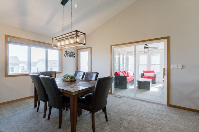 310 34th Ave, Marion, IA 52302 - dining space with lofted ceiling, healthy amount of natural light, carpet, and a ceiling fan