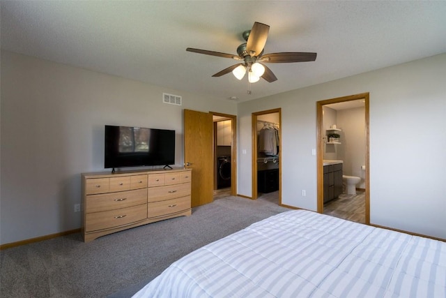 310 34th Ave, Marion, IA 52302 - bedroom featuring light carpet, a spacious closet, washer / clothes dryer, and a closet