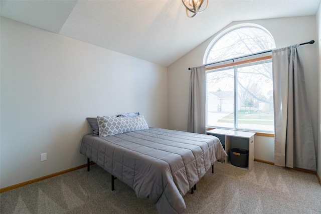 310 34th Ave, Marion, IA 52302 - carpeted bedroom with lofted ceiling and baseboards