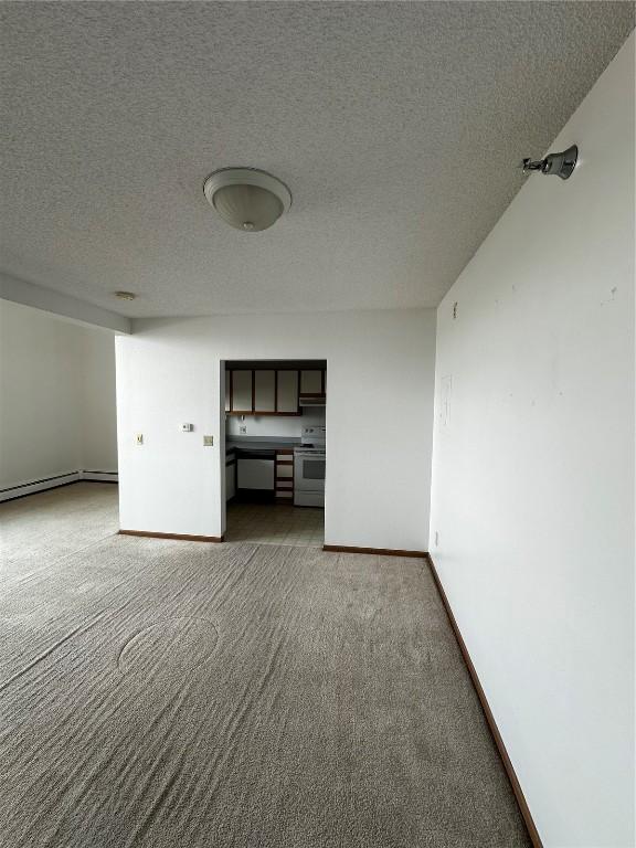 400 1st St SE Unit 410, Cedar Rapids, IA 52401 - carpeted empty room featuring a textured ceiling