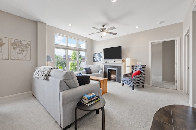 843 Quarry Rd Unit 216, Coralville, IA 52241 - living room featuring light carpet, a ceiling fan, recessed lighting, and a tiled fireplace
