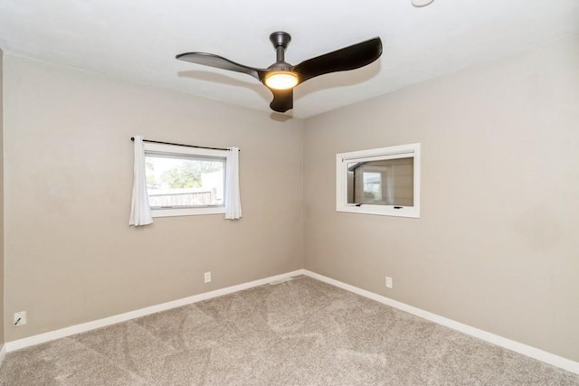 2175 Chandler St SW, Cedar Rapids, IA 52404 - carpeted spare room featuring a ceiling fan and baseboards