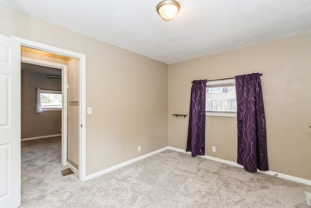 2175 Chandler St SW, Cedar Rapids, IA 52404 - carpeted empty room with plenty of natural light